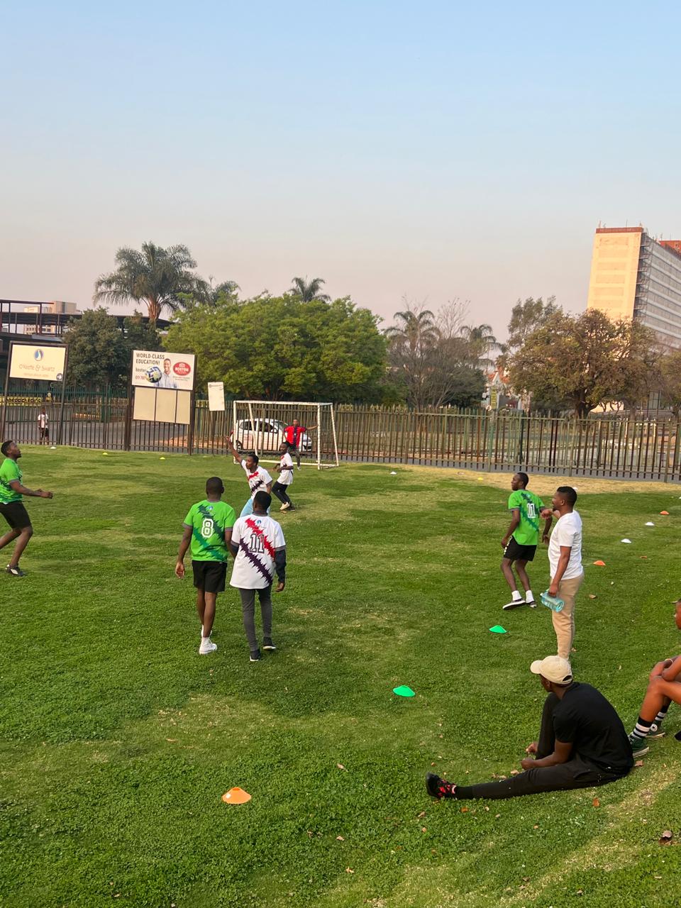 Employees playing soccer at a corporate sports day